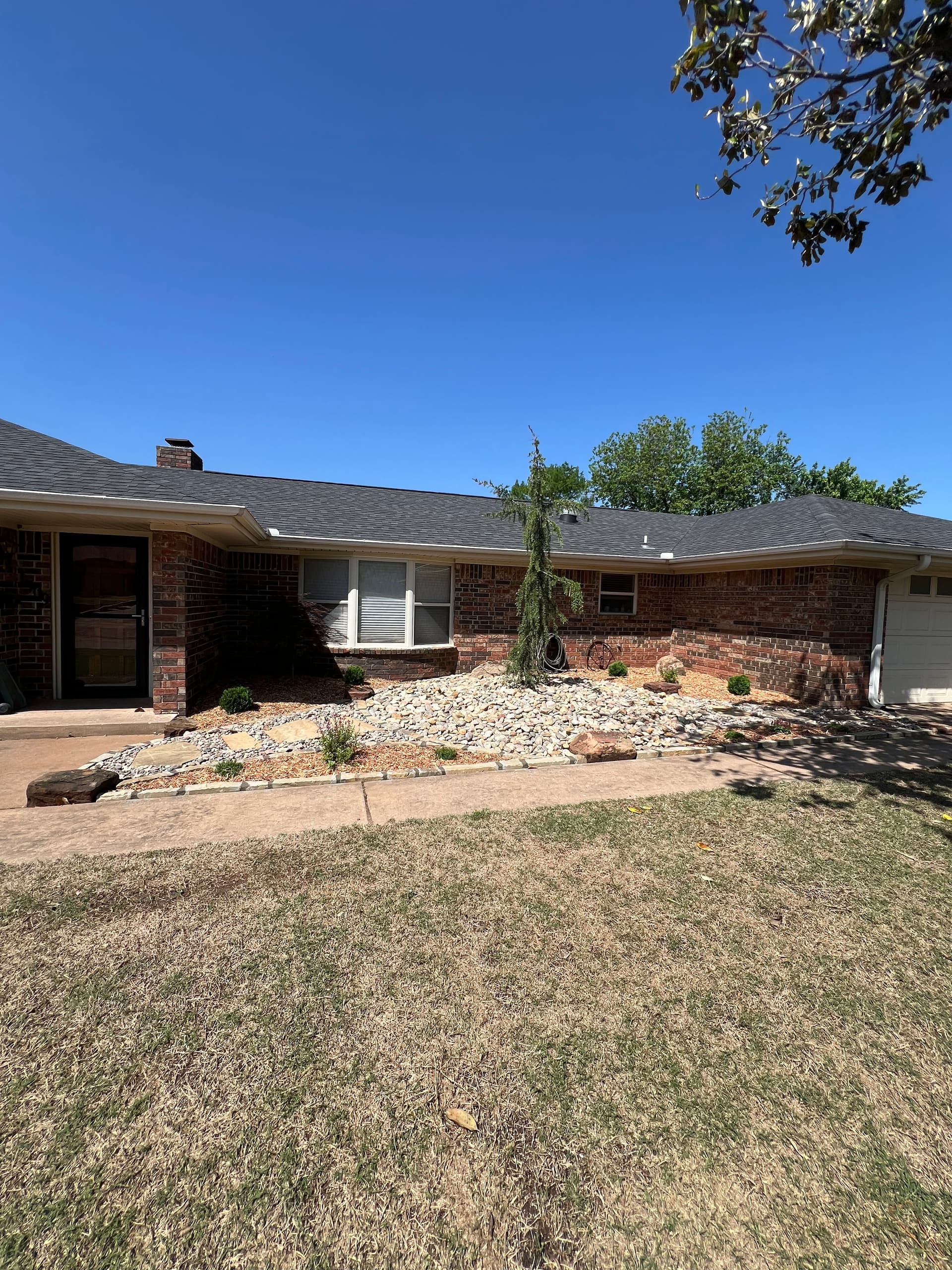 Gallery photos for Overgrown Front Yard Gets a Clean Low-Maintenance Rock Landscape: Image #3