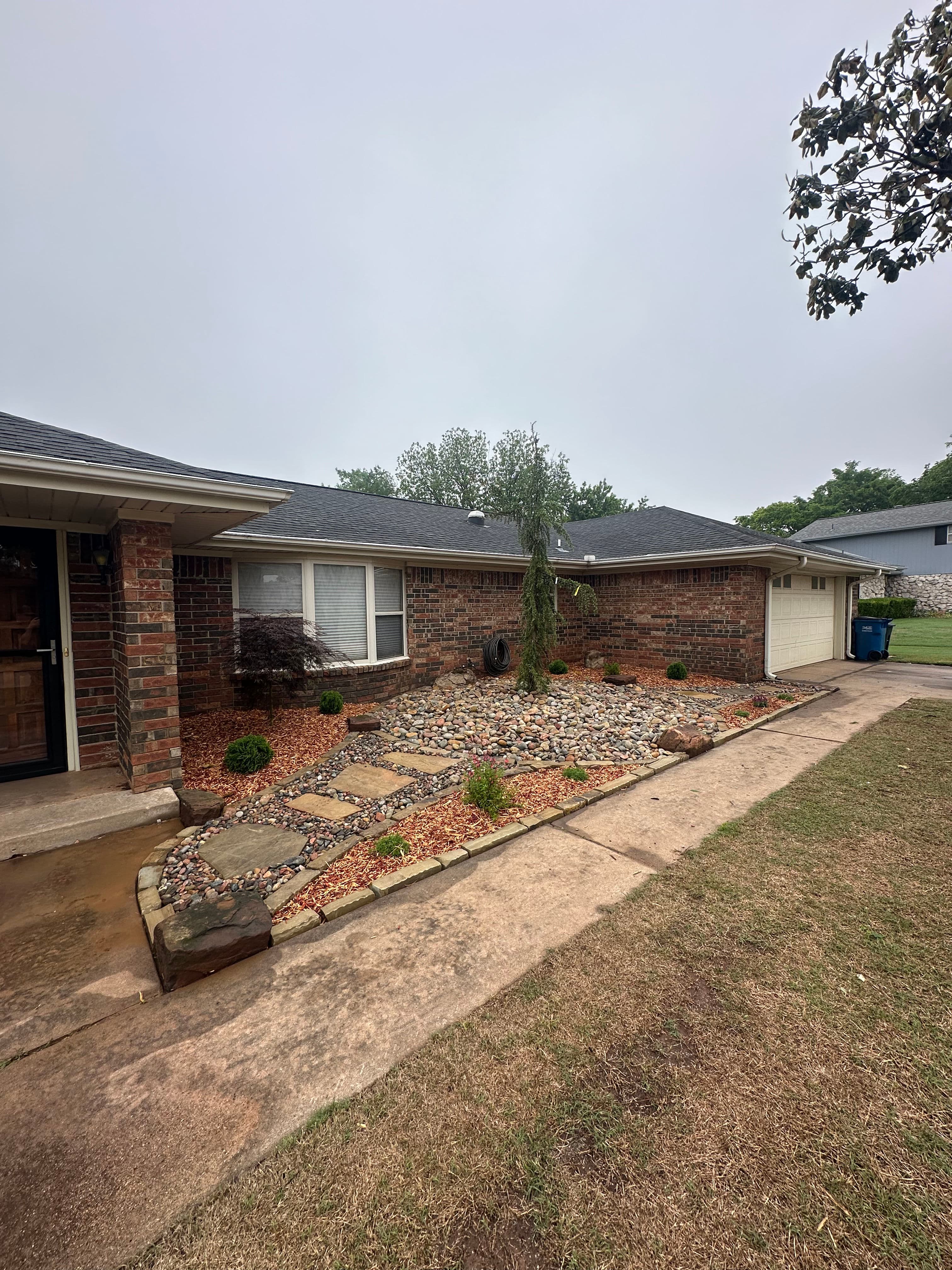 Project Overgrown Front Yard Gets a Clean Low-Maintenance Rock Landscape image
