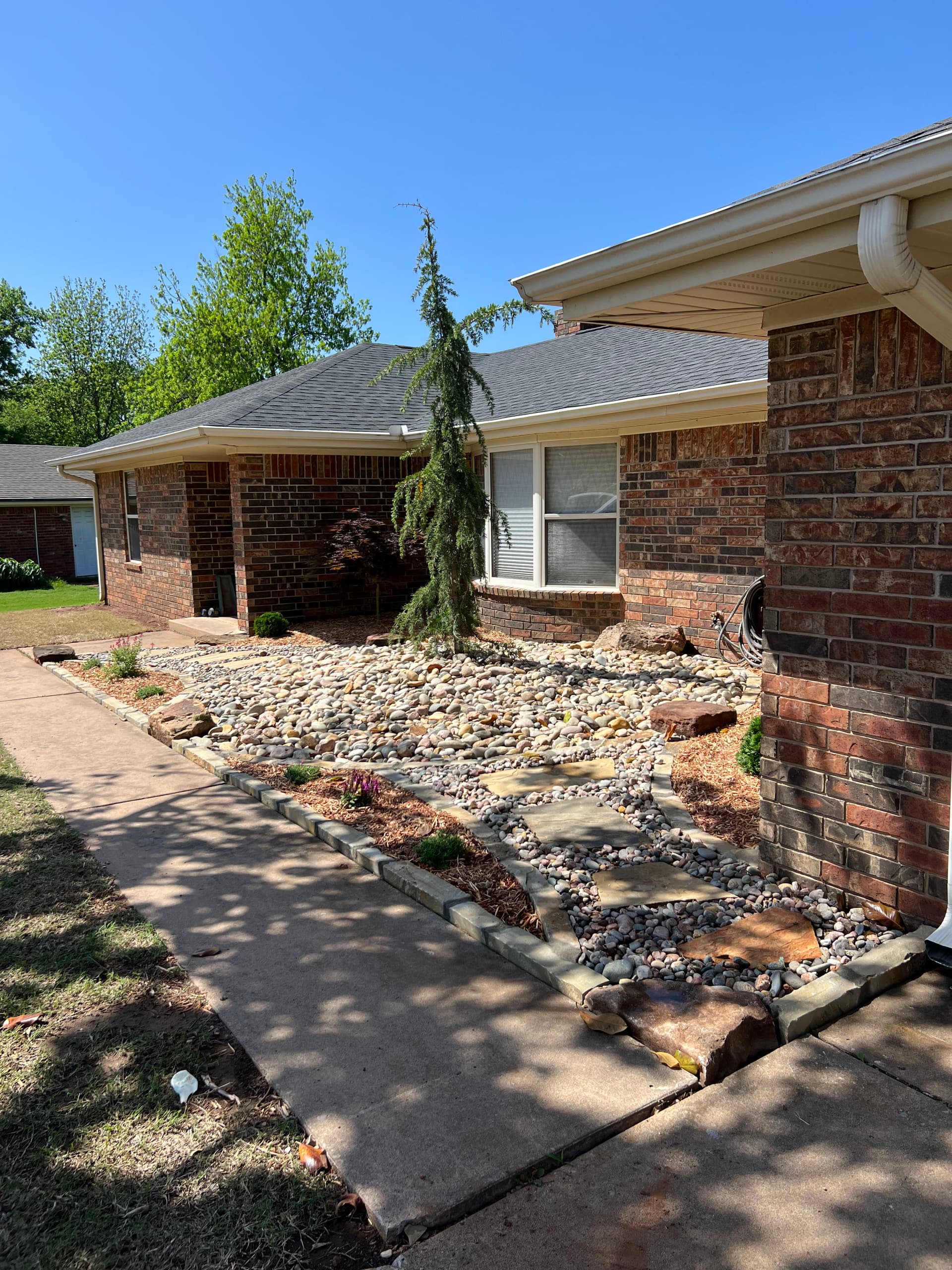 Gallery photos for Overgrown Front Yard Gets a Clean Low-Maintenance Rock Landscape: Image #7