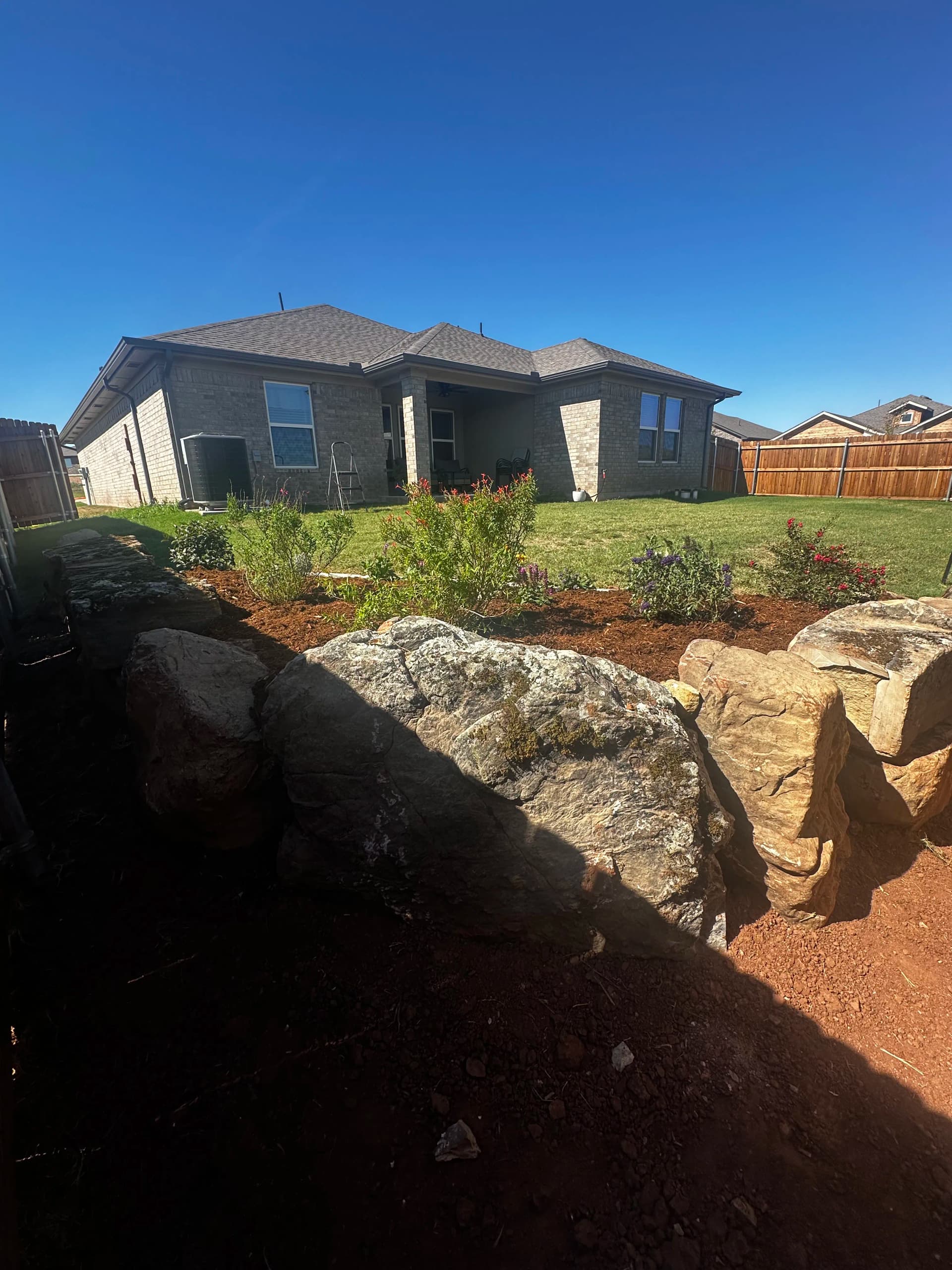 Boulder Retaining Wall and Oklahoma Native Pollinator Garden Installation image